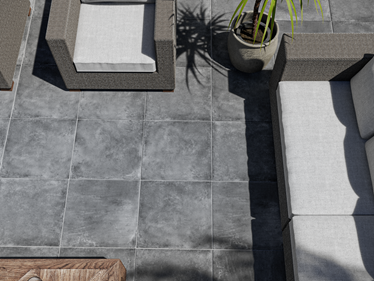 Coin détente avec canapé sur le dallage imitation béton Vulkano