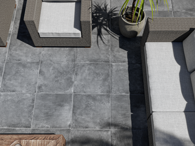 Coin détente avec canapé sur le dallage imitation béton Vulkano