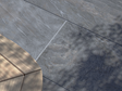 Les dalles effet quartzite Monro Dark sur la terrasse avec le coin d'une table