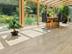 Le carrelage en travertin Natura dans un jardin d'hiver