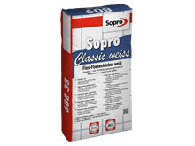 Un sac de mortier-colle flexible blanc