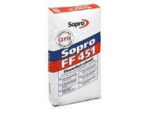 Un sac mortier-colle flexible gris à prise rapide