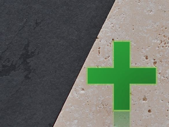 Pierre naturelle claire à côté de la pierre naturelle foncée, sur laquelle se trouve une croix verte